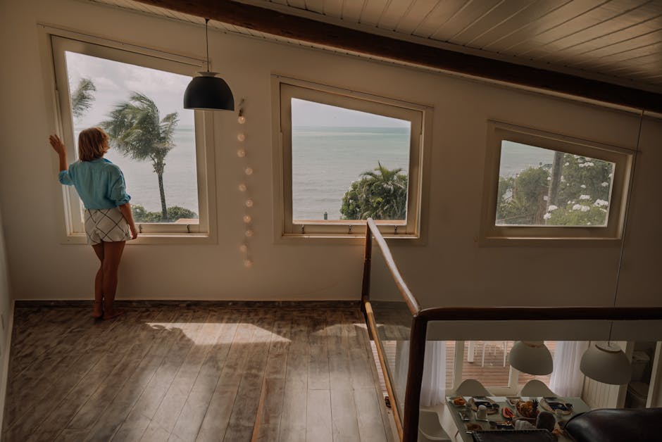 guest-holiday-home-looking-out-window-view