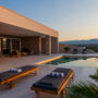 Modern villa terrace with pool at sunset